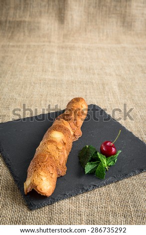 Cookies and cakes with fruit on slate plate