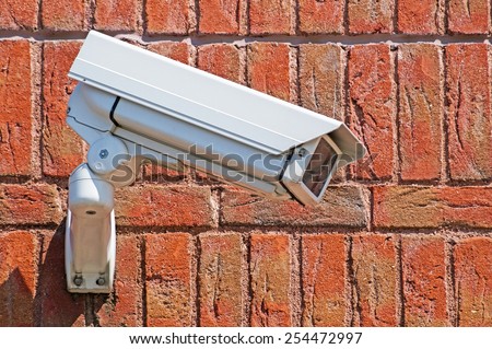 Security camera on the wall of a building
