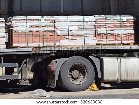 Truck loaded with paving stones at the road construction