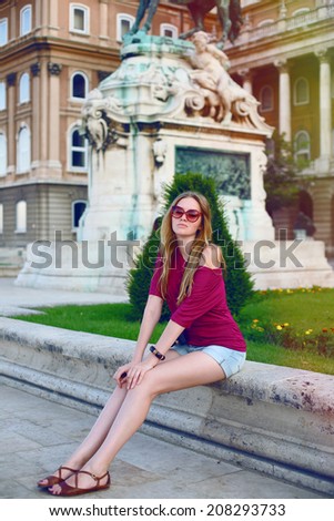 Pretty girl traveling in old european city Budapest, have fun alone.