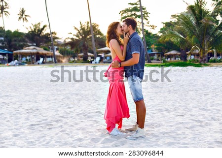 Stylish sensual beautiful fashion close up portrait of happy couple in love posing in summer outdoor .Beach, vacation, pleasure, tropical country.