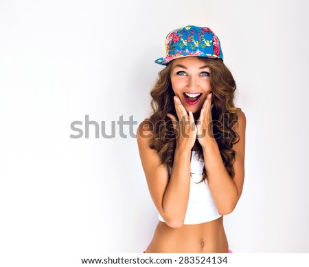 Young hipster girl going crazy, have positive surprised emotions, screaming and laughing, bright summer outfit.