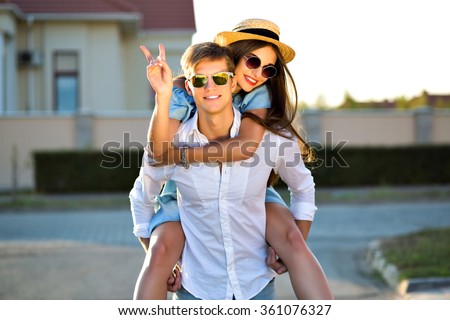 Fashion summer image of elegant vintage styled couple in romantic valentine day, having great time together, hugs and kisses, hipsters, stylish clothes and sunglasses, beautiful lovers, family outdoor