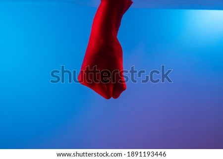 strong sign.hand pose in red and blue light