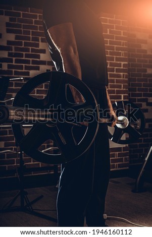 fitness man doing exercises in the gym. fitness and Healthy Lifstyle Concept