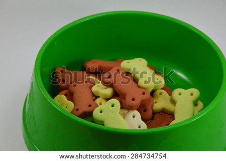 dog biscuit in green bowl