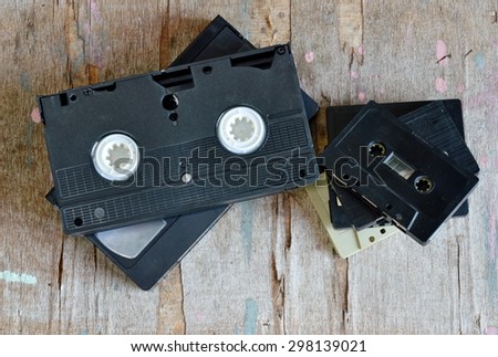 video tape and cassette tape on wood board