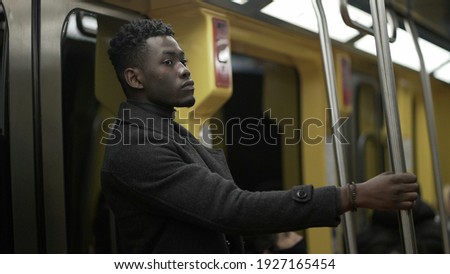 Black man commuting at subway underground metro