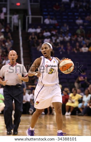 PHOENIX, AZ - JULY 22: Temeka Johnson (2) calls out a play while bringing the ball down court during Wednesday nights WNBA game between the Phoenix Mercury and the Minnesota Lynx on July 22, 2009