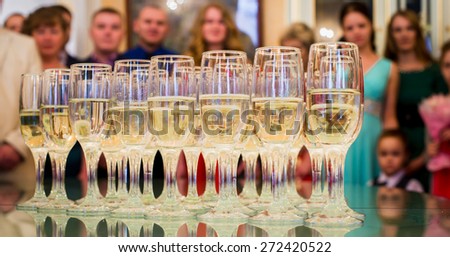 set standing on a table with glasses of champagne