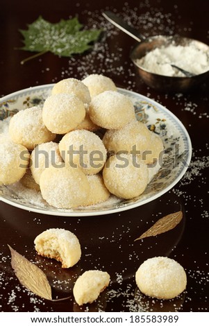 Areias - Portuguese Sugar Cookies on white plate, on dark background.