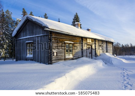 Old swedish farm house in snow Old wooden farm house in swedish countryside in winter and snow.