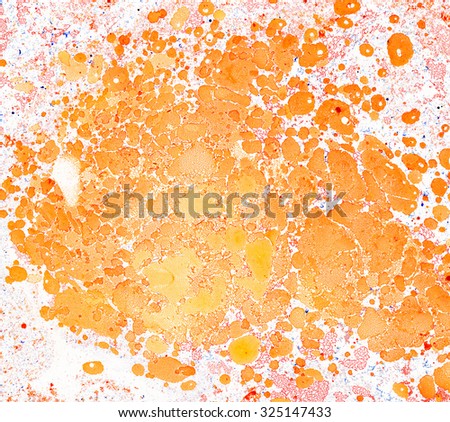 Scenic background from spots and stains of oil paint in orange tones