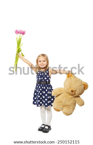 Little girl with flowers and a teddy bear on a white background