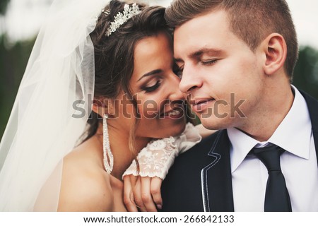 Groom suit and bride in wedding white dress on nature
