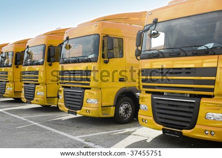Yellow trucks stand in line