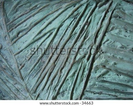 Surface of a bronze statue marked by the forces of nature.