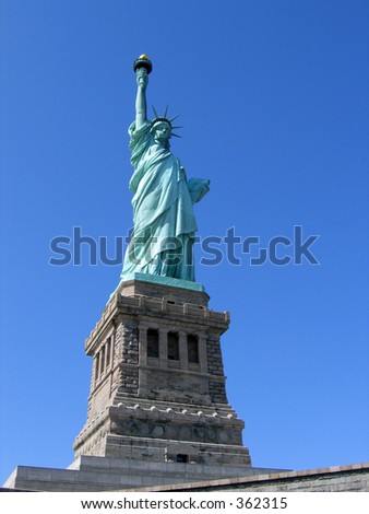 Statue of Liberty against blue sky.