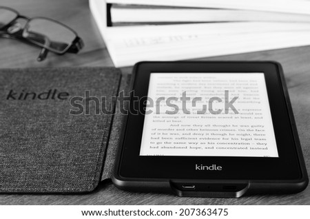 LEEDS, UK - JULY 16: Amazon Kindle paper white e book reader, processed in black and white. July 16, 2014 in Leeds, UK.
