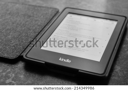 LEEDS, UK - JULY 16: Amazon Kindle paper white e book reader, image processed in black and white. July 16, 2014 in Leeds, UK.