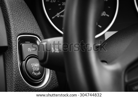 Engine start stop button in a modern passenger car.