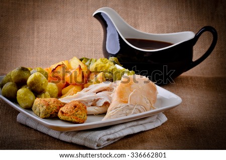 Traditional Sunday dinner with gravy boat.