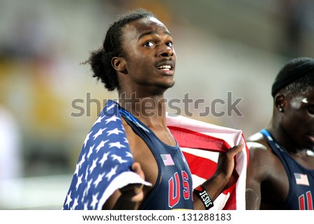 BARCELONA - JULY, 13: Aaron Ernest of USA watch the counter celebrating silver medal during the 20th World Junior Athletics Championships at the Olympic Stadium on July 13, 2012 in Barcelona, Spain