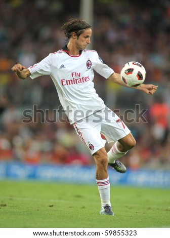 BARCELONA - AUGUST 25: Luca Antonini of AC Milan in action during Trophy Joan Gamper match between FC Barcelona and AC Milan at Nou Camp Stadium on August 25, 2010 in Barcelona, Spain.