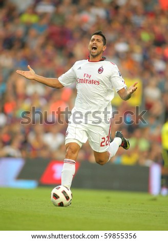BARCELONA - AUGUST 25: Borriello of AC Milan in action during Trophy Joan Gamper match between FC Barcelona and AC Milan at Nou Camp Stadium on August 25, 2010 in Barcelona, Spain.