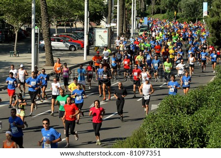 BARCELONA - JUNE 26: Runners on the popular race of the Olympic Village that take place through the streets of Barcelona on June 26, 2011 in Barcelona, Spain