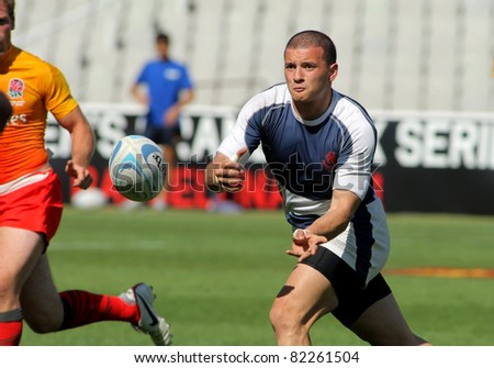 BARCELONA - JULY 9: Rati Nutsubidze of Georgia drives the ball during the match of Rugby7 European Championship between England and Georgia at the Olympic Stadium in Barcelona, on July 9, 2011