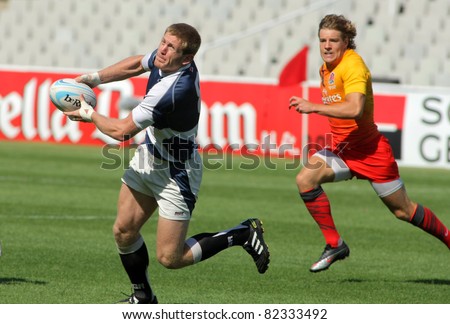 BARCELONA - JULY, 9: Giorgi Jimsheladze of Georgia drives the ball during the match of Rugby7 European Championship between England and Georgia at the Olympic Stadium in Barcelona, on July 9, 2011