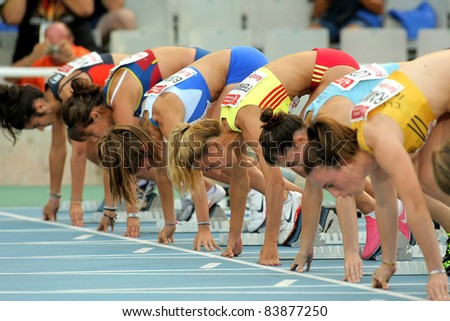 BARCELONA - JULY 22: Athletes ready on the start of 100m Event of Barcelona Athletics meeting at the Olympic Stadium on July 22, 2011 in Barcelona, Spain