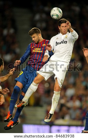 BARCELONA AUG 17 Gerard Pique L of FC Barcelona vies with Sergio Ramos R of Real Madrid during the Spanish Supercup football match at the New Camp Stadium in Barcelona on August 17 2011 BARCELONA AUG 17 Gerard Pique L of FC Barcelona vies with Sergio Ramos R of Real Madrid during the Spanish Supercup football match at the New Camp Stadium in Barcelona on August 17 2011
