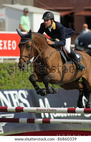 BARCELONA, SPAIN - SEPT, 23: Cassio Rivetti of Ukraine in action rides horse Verdi during the 100th CSIO event at the Real Club de Polo Barcelona on September 23, 2011 in Barcelona, Spain