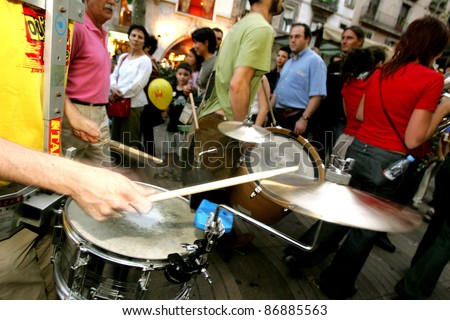 BARCELONA - SEPT, 24: Musicians of music troop Les Ouiche Lorenea in full swing performing his show at Las Ramblas during a Festival City on September 24, 2004 in Barcelona, Spain