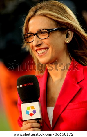 BARCELONA - SEPT 24: Lola Hernandez of Telemadrid reports before the Spanish league match against Atletico Madrid at the Nou Camp Stadium on September 24, 2011 in Barcelona, Spain