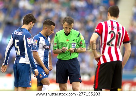 BARCELONA - APRIL, 12: Referee Fernandez Borbalan with players during a Spanish League match between RCD Espanyol and Athletic de Bilbao at the Power8 Stadium on April 12 2015 in Barcelona Spain