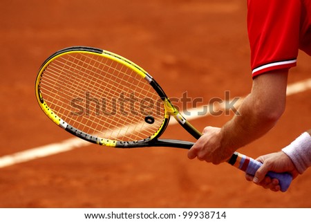 A tennis player waiting for a serve during a match