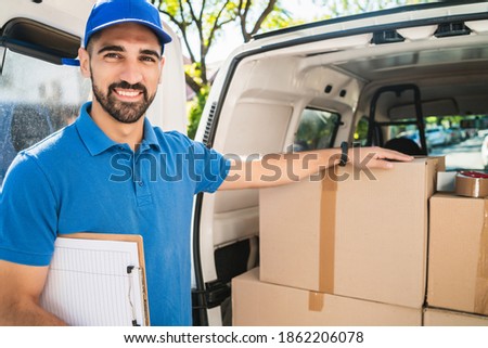 Delivery man checking the products with checklist.