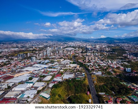 Beautiful c aerial view of the city of San Jose Costa Rica with view of the Sabana Park, and Churches
