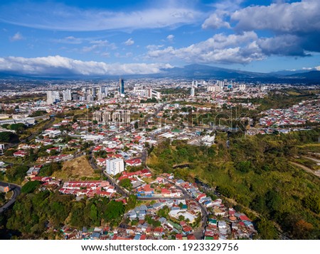 Beautiful c aerial view of the city of San Jose Costa Rica with view of the Sabana Park, and Churches