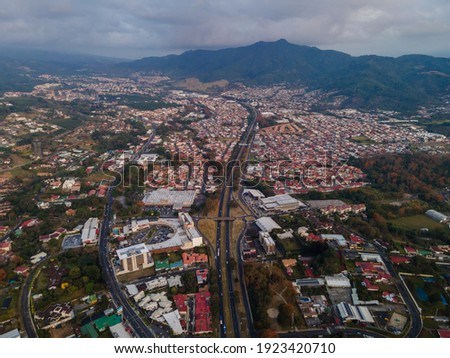 Beautiful aerial view of the City of San Jose Costa Rica, Its park Sabana, buildings at sunset