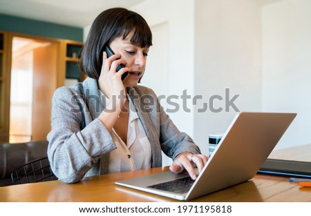Young woman working at home. Home office.