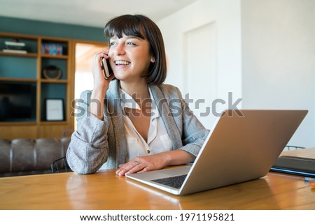 Young woman working at home. Home office.