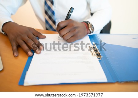 Businessman working with papers at office.