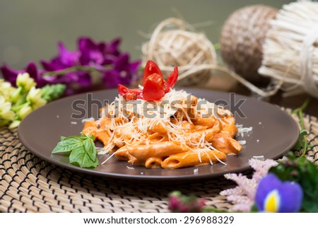 Pasta with red sauce. Penne funghi. Italian quisine