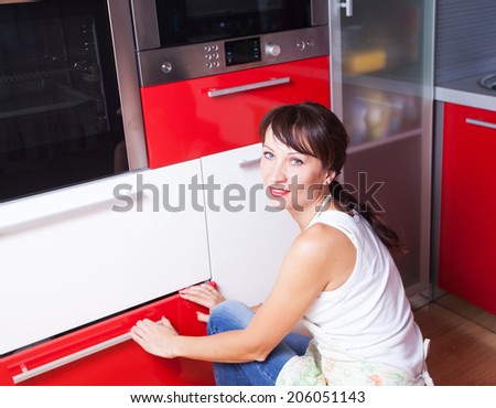 the woman in the kitchen the microwave oven