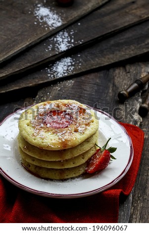 Pancakes with coconut and strawberries