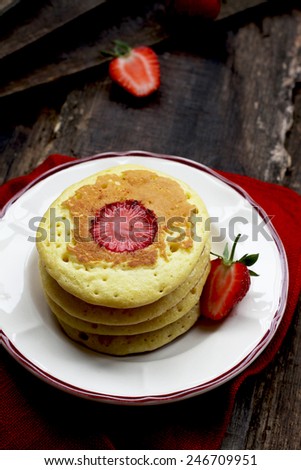 Pancakes with coconut and strawberries